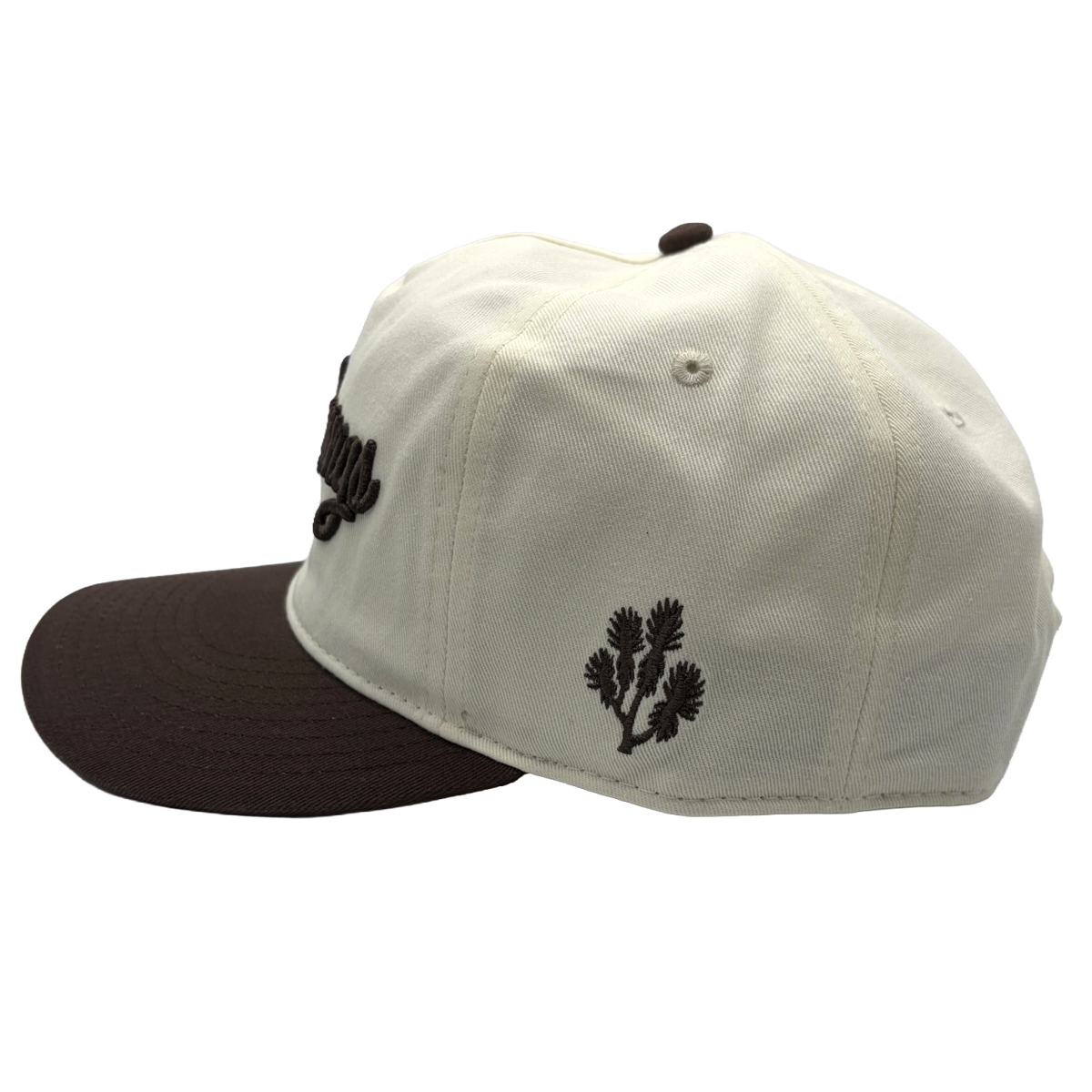 Classic style meets course-ready comfort. This cream and brown Coyote Springs cap features premium raised embroidery and a timeless two-tone design perfect for the golf course or everyday wear.
