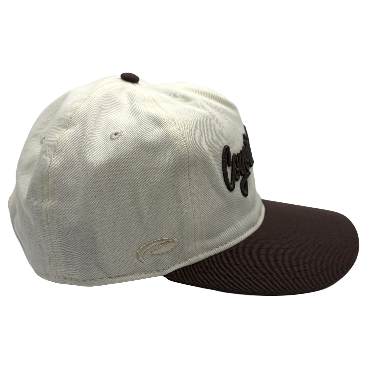 Classic style meets course-ready comfort. This cream and brown Coyote Springs cap features premium raised embroidery and a timeless two-tone design perfect for the golf course or everyday wear.