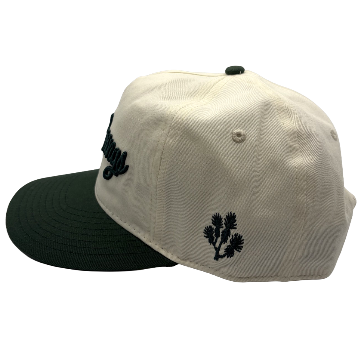 Classic style meets course-ready comfort. This cream and green Coyote Springs cap features premium raised embroidery and a timeless two-tone design perfect for the golf course or everyday wear.